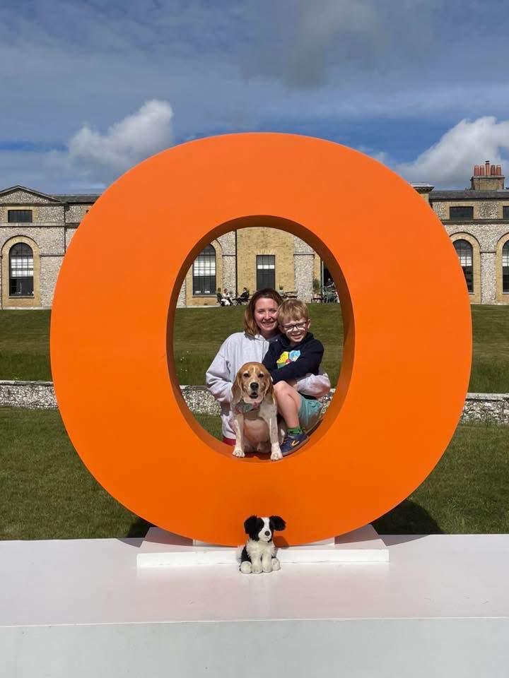 Dee with her son and Eddie the beagle enjoying a day out